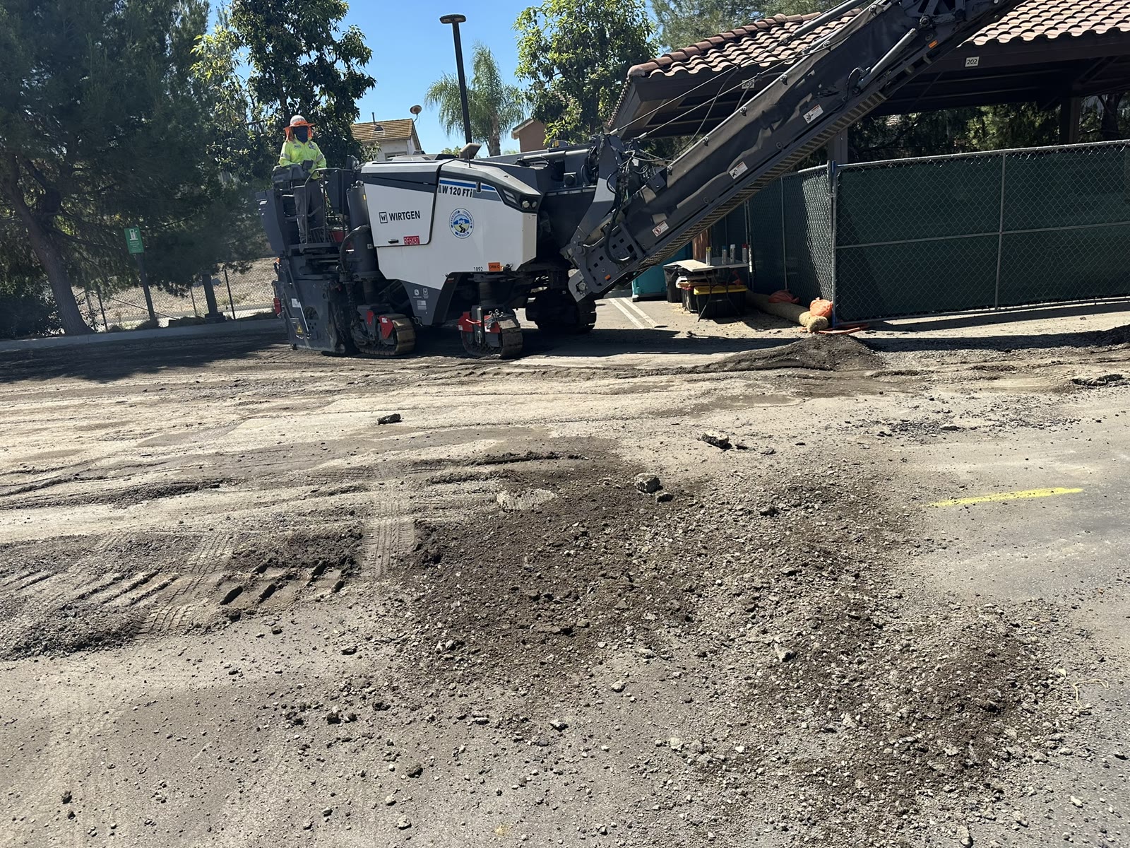 Milling machine grinding out asphalt pavement in Chino Hills, CA