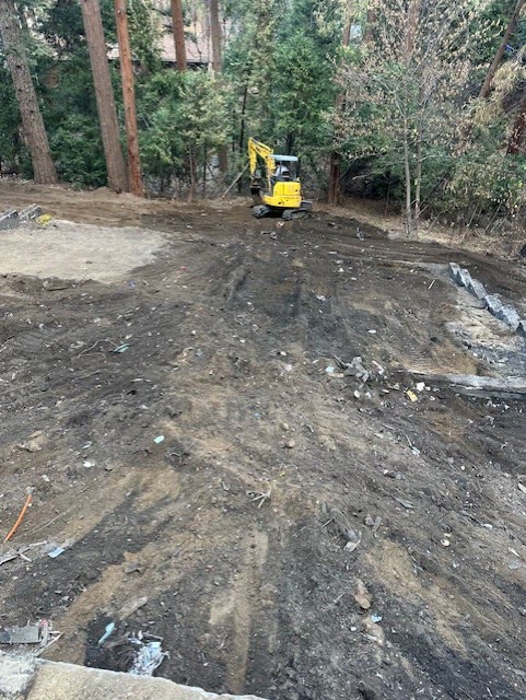 Cleared and graded lot after fire-damage house demolition in Crestline, CA