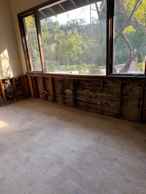 Room stripped to studs and slab during interior demolition in Encino, CA
