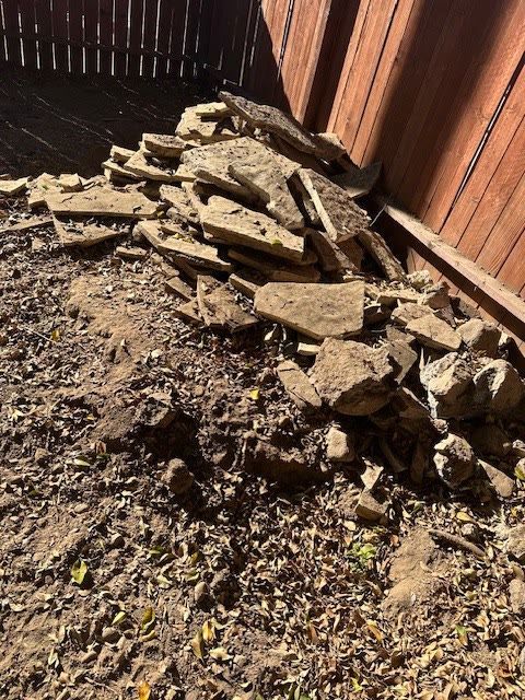 Broken concrete slabs stacked during concrete removal in Pasadena, CA