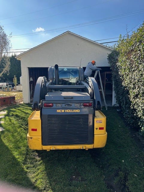 Skid steer at detached garage before demolition in Venice, Los Angeles